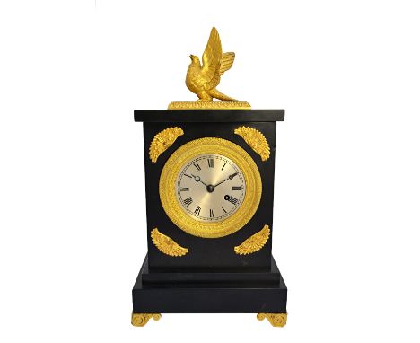 A Regency ormolu black slate mantel timepiece, early 19th century the silvered dial with Roman numerals and with a fusee move