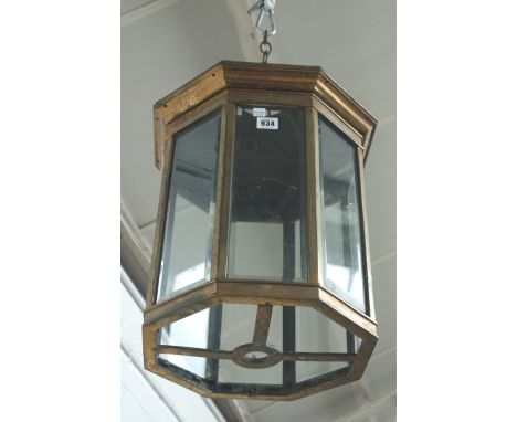 A gilt metal and glass hall lantern, 19th century, of octagonal form, with domed top and inset bevelled panels (a.f), 49cm hi