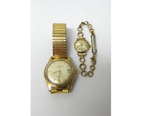 A gentleman's gold circular cased Jaeger-Le Coultre Automatic wristwatch, the signed circular silvered dial with gilt baton s