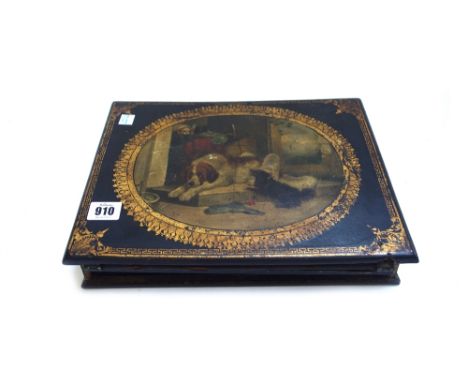 A Victorian papier mache writing slope, the hinged lid decorated with a dog group, 32cm wide, a Victorian papier mache twin d