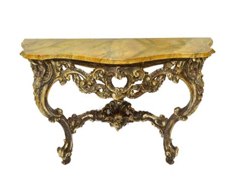 A late 19th century Italian console table, the faux painted serpentine marble top over a pierced and carved silvered base, wi