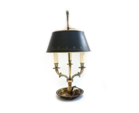 A bouillotte table lamp, 20th century, with foliate cast ring handle, green tin adjustable shade and three light fitment on a