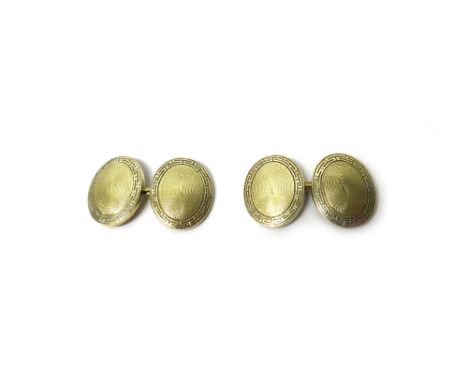 A pair of gold cufflinks, the backs and the fronts of dished oval form, with engine turned decoration to the centres within e