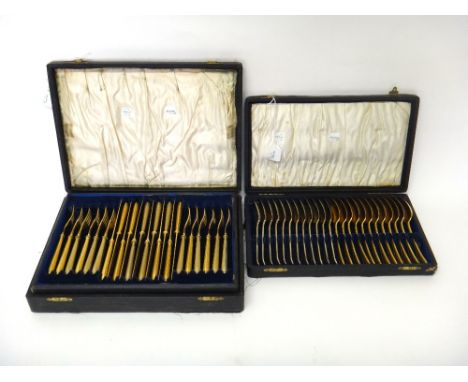 A set of twelve Victorian silver gilt, double struck, bead edged Old English pattern dessert spoons, crest engraved, London 1