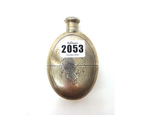 A Victorian silver oval spirit flask, with a pull-off beaker base, the exterior with engine turned decoration, London 1876, w