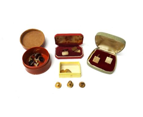 A pair of 9ct gold cufflinks, having square fronts, with a textured finish and with folding bar fittings to the backs, London