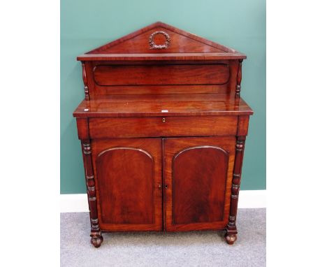An early Victorian mahogany chiffonier, with architectural ledge back over single drawer and a pair of arch panel cupboards, 