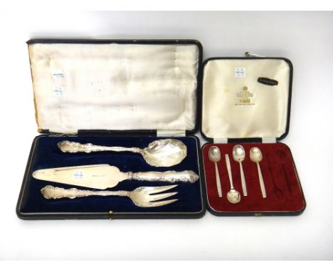 Three similar silver serving implements, comprising; a serving slice and fork, Birmingham 1922 and a serving spoon, Birmingha