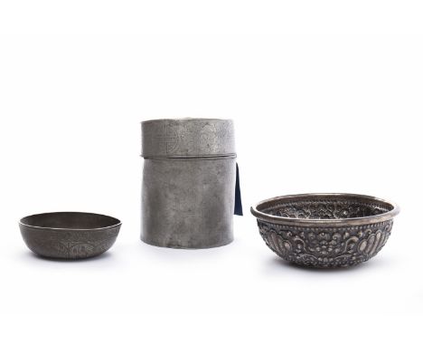 TIBETAN SILVER BOWLwith mythical face decoration in relief, 13.5cm diameter; along with a an Eastern metal caddy and a anothe