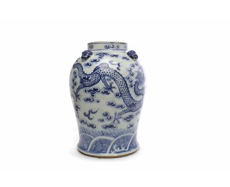 MID 20TH CENTURY CHINESE BLUE AND WHITE JARdecorated with dragons chasing the flaming pearl, lid lacking, 35cm high 