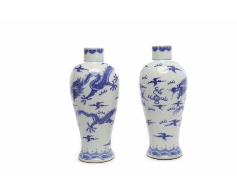 PAIR OF MID 20TH CENTURY CHINESE BLUE AND WHITE VASES decorated with dragon chasing the flaming pearl, six character mark to 