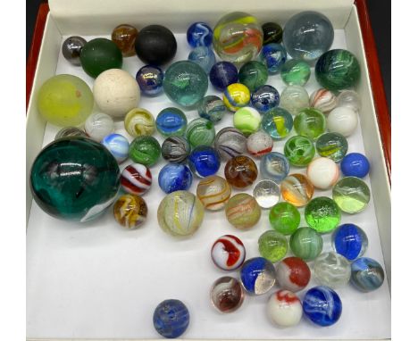 A Selection of vintage and antique glass marbles to include Antique German twist cane marbles. 