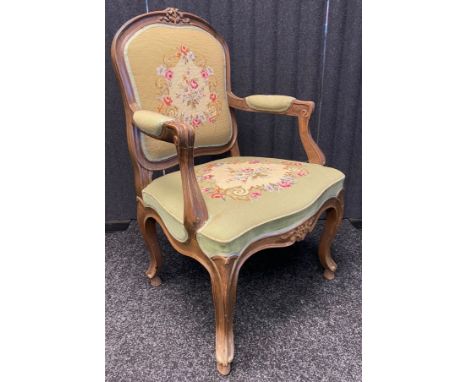 Antique French style arm chair, the whole covered in a floral tapestry upholstery and raised on cabriole legs. 