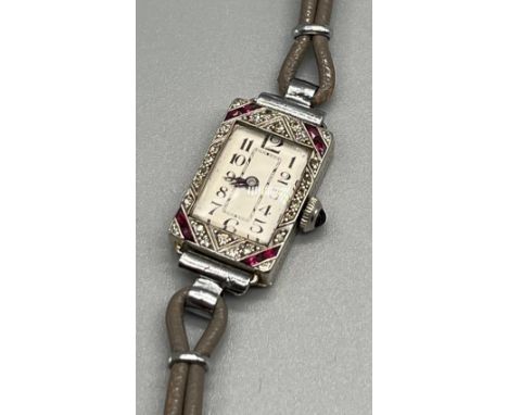 Art Deco design 18ct white gold and Platinum ladies cocktail watch, designed with ruby stones and diamond stones. Watch worki