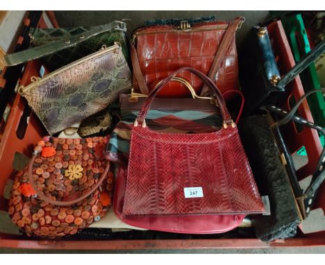 A crate of vintage hand bags 