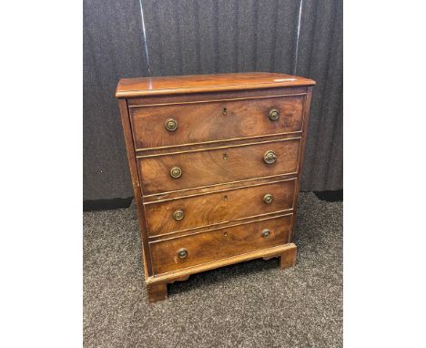 19th century burr walnut chest the rectangular top above four dummy drawers, two lifting to reveal a commode area, raised on 