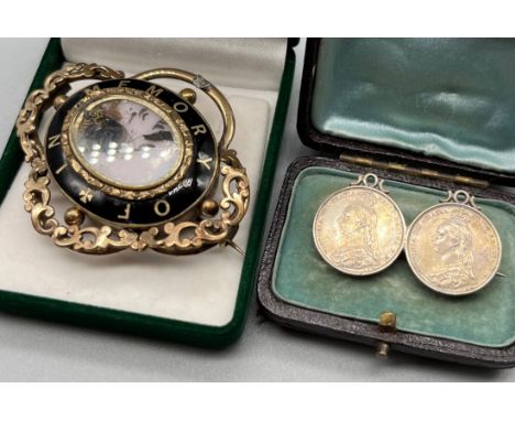Victorian gold tone and enamel mourning brooch together with a silver brooch made from two 1887 Queen Victoria six pence coin