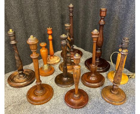 A Collection of antique turned wood table lamp bases. 