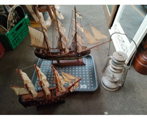 2 ship models together with storm lamp 