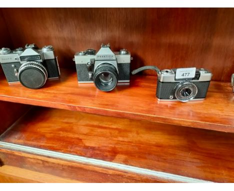 Shelf of vintage cameras includes pracktica etc 