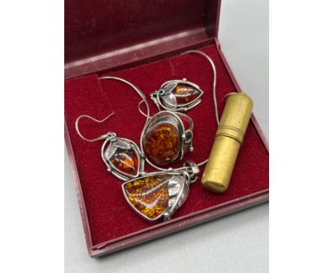 Silver necklace with silver and amber pendant, matching ring and earrings. Together with a vintage pendant perfume bottle pen