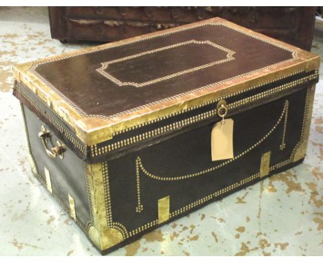 TRAVELLING TRUNK, Regency black leather and brass studded with rising lid and carrying handles, 85cm W x 53cm D x 42cm H.