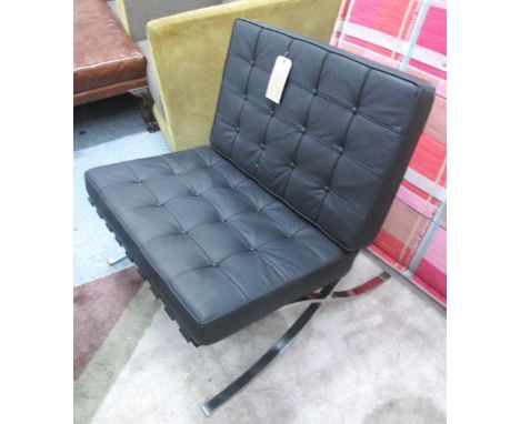 BARCELONA STYLE CHAIR, in a black leather button backed finish, on polished metal supports, as originally by Ludwig Mies van 