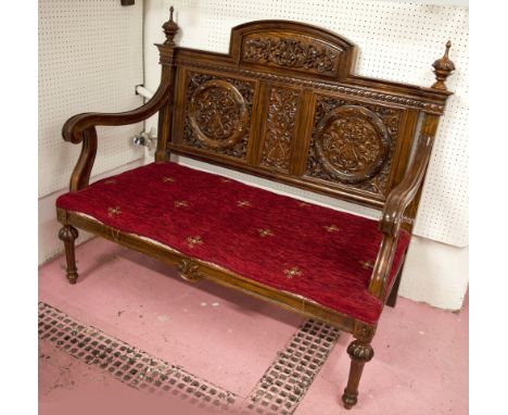 SOFA, Indian rosewood in Colonial taste with carved back and red chenille covered seat, 125cm W. (upholstery with faults)