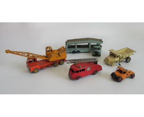 A collection of five miscellaneous play-worn Dinky toys, to include: dump truck, fire engine, crane and other related toys.