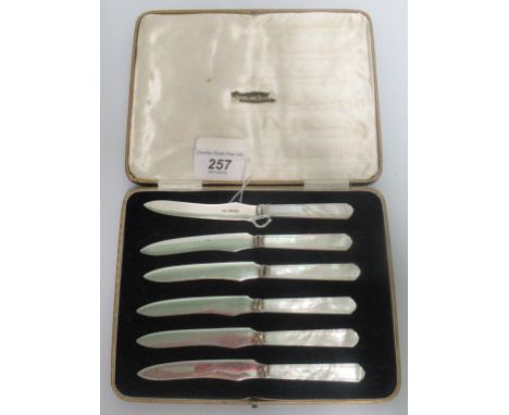 A cased set of hallmarked silver and mother of pearl handled fruit knives.
