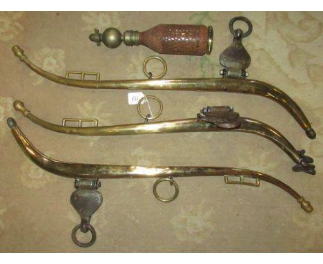 A collection of three heavy brass hames, together with vintage soda siphon.