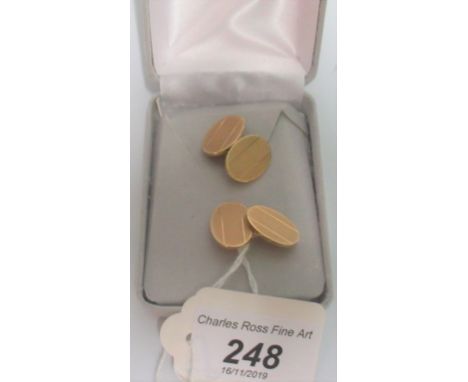 A pair of 9ct gold cufflinks, oval engine turned, Birmingham 1963. Condition Report: Weight = 13.9 g 