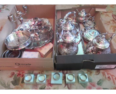 Two boxes containing a large quantity of silver plate, to include: Five Hallmarked silver serviette ring, a four piece tea se