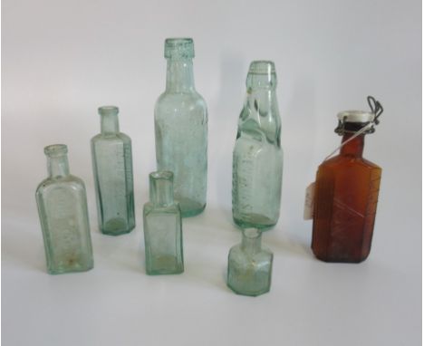 A collection of seven various vintage bottles.