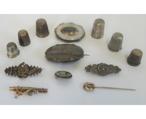 A Victorian mourning brooch, with central over glazed panel, together with a seed pearl bar brooch and various Victorian broo