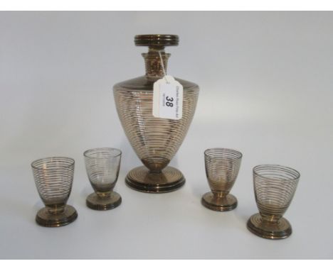 An Art Dec-style black and gold decanter, together with four matching liqueur glasses.