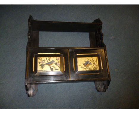 A 19th century ebonised hanging shelf, having lower two door cupboard with decorative bird design, with pierced sides and gil