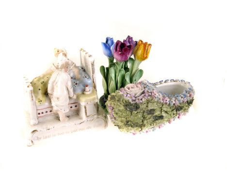 An assortment of various ceramics, to include fairings, crested ware, a small Crown Staffordshire floral group, a small conti