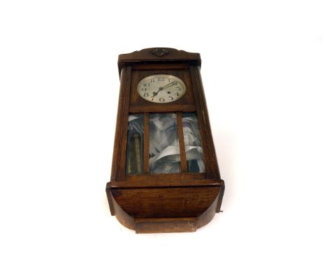 An oak cased wall clock, having black Arabic numerals on metallic dial, with lower bevelled glass section