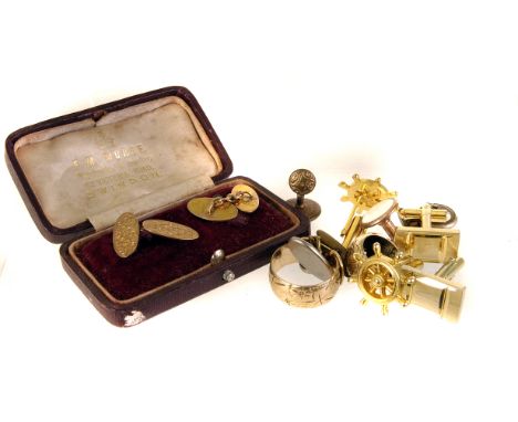 A 9ct gold buckle ring, together with a pair of 9ct gold cufflinks, a gold earring and a selection of other cufflinks (parcel