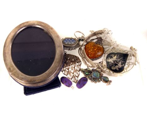 A small collection of silver jewellery, including a mosaic brooch, golf cufflinks, an amber style drop pendant, bangles and m