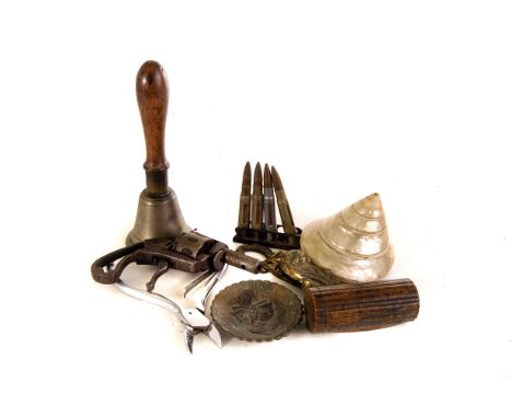 A selection of miscellaneous items, including a 19th century cork screw, four training rounds, a treen box, a nut cracker and