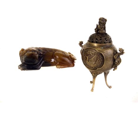 An oriental brass censor, with mythical creature handles and decoration, pierced cover with dog of fo finial on tripod base, 
