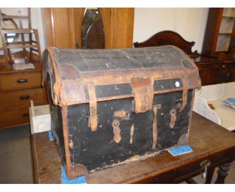 A painted canvas covered wicker carriage trunk, with arch top and leather strapping