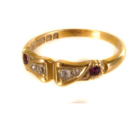 An 18ct gold diamond and ruby ring, having four graduated round cut diamonds flanked by two rubies, set in an 18ct gold band,