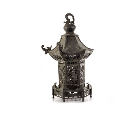 A Chinese spelter lamp base in the form of a Pagoda, having pierced dragon and swag design to the body, with dragon finial, w