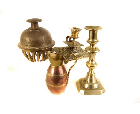 A selection of various metal ware, to include an Indian bell, a pair of 19th century brass candlesticks, a continental brass 