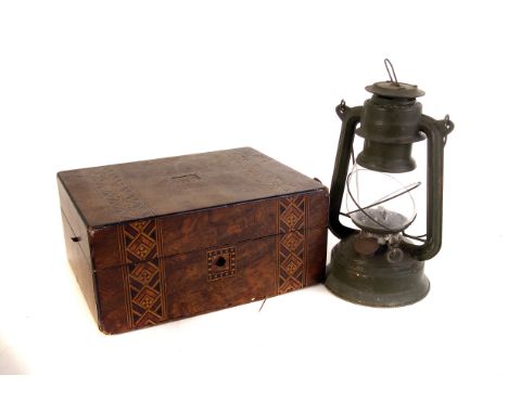 A collection of sewing items, including thread, buttons etc, all contained in an inlaid box, together with a vintage oil lamp