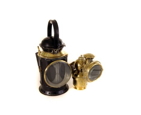 A vintage Calcia King brass motoring lamp by Jos Lucas Ltd, together with a brass and black painted railway man's lamp, marke