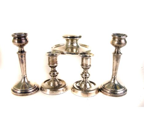 A pair of 925 marked dwarf candle sticks, together with another pair of slightly larger silver candle sticks, plus a silver c